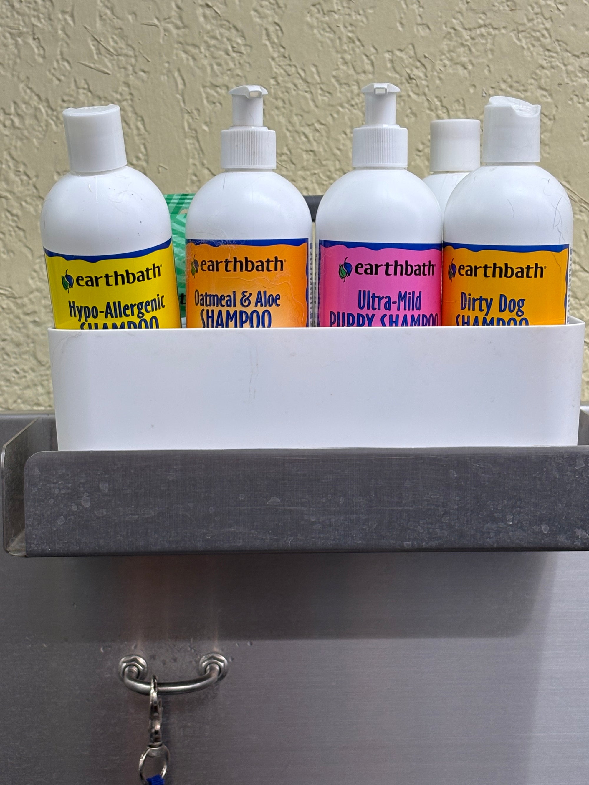 shelf with various earthbath bottles lined up