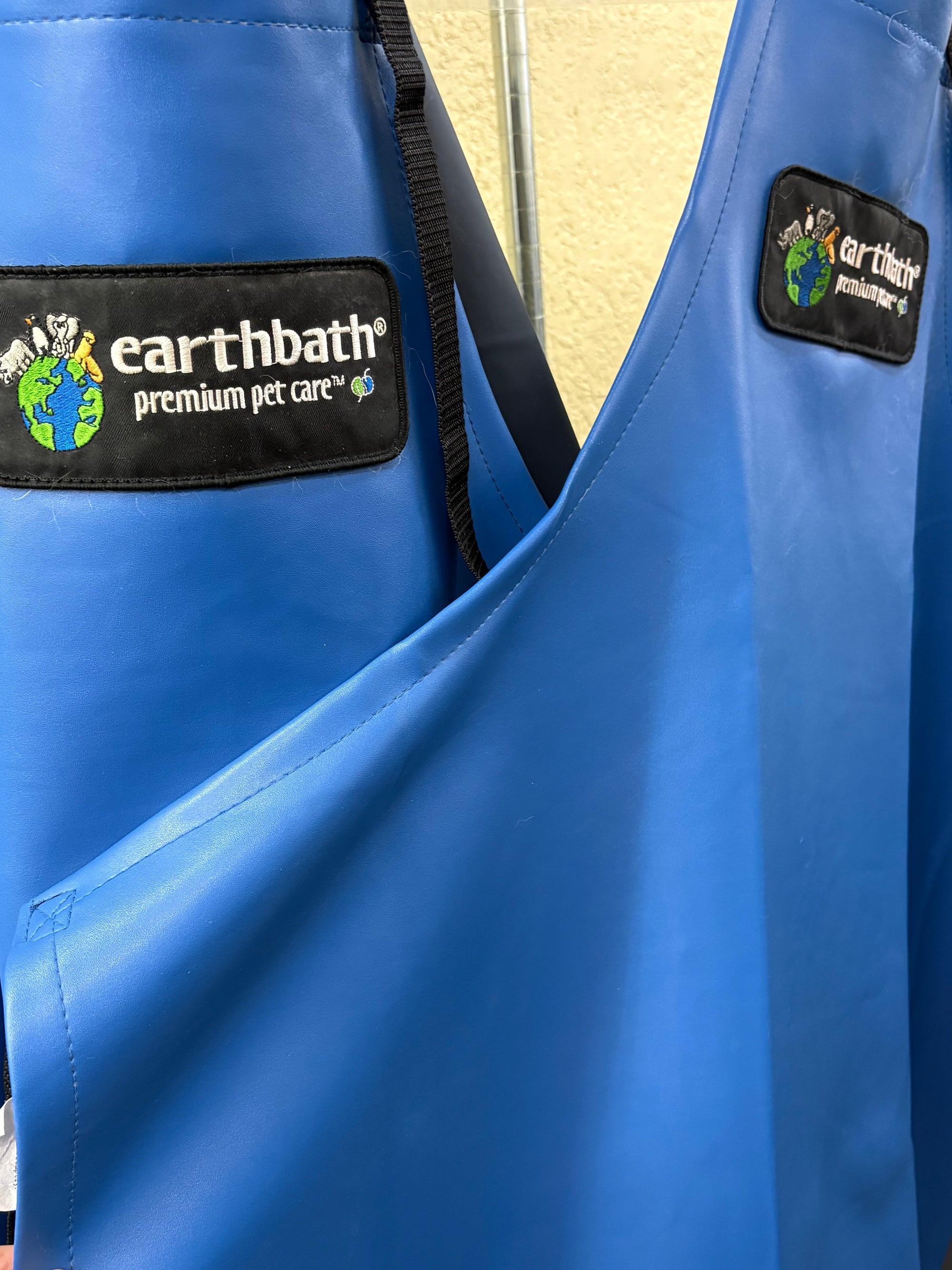 blue earthbath aprons hanging up