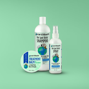 earthbath pet care products including shampoo, spray, and balm on a green background