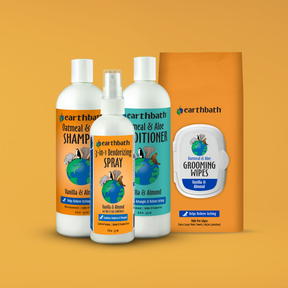 Earthbath pet care product set including shampoo, conditioner, spray, and wipes on an orange background