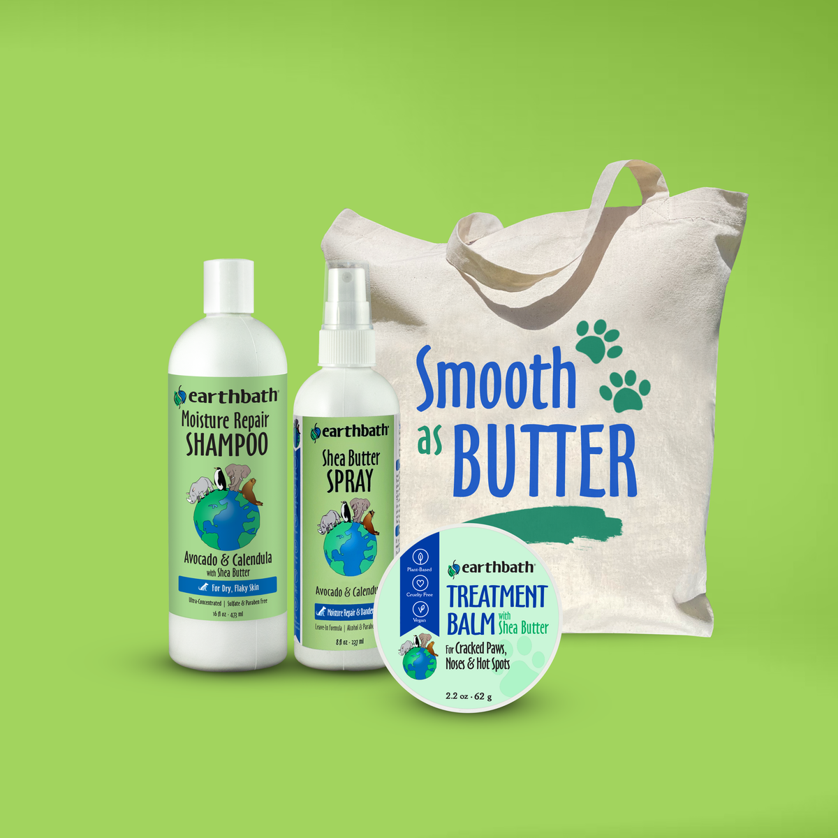 A collection of pet grooming products including shea butter shampoo, spray, and treatment balm, along with a reusable canvas shopping bag with the text 'Smooth As Butter' and paw prints.