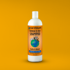 Earthbath Oatmeal & Aloe Shampoo bottle on an orange background