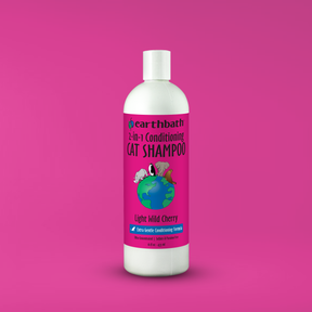 Bottle of Earthbath cat shampoo on a pink background