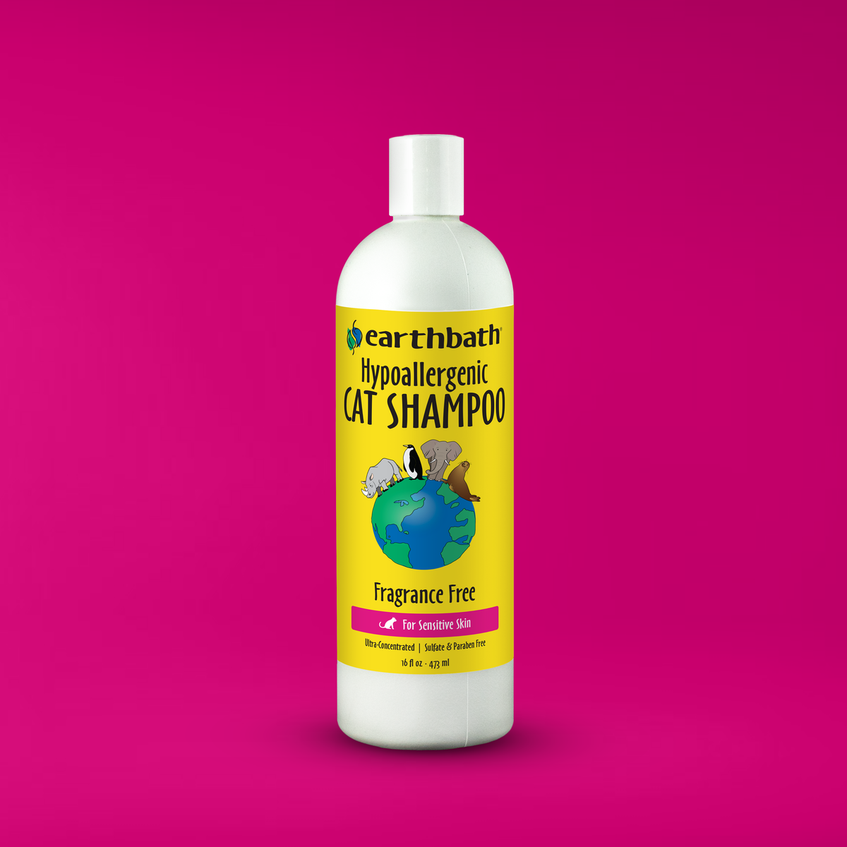 Bottle of Earthbath hypoallergenic cat shampoo on a pink background