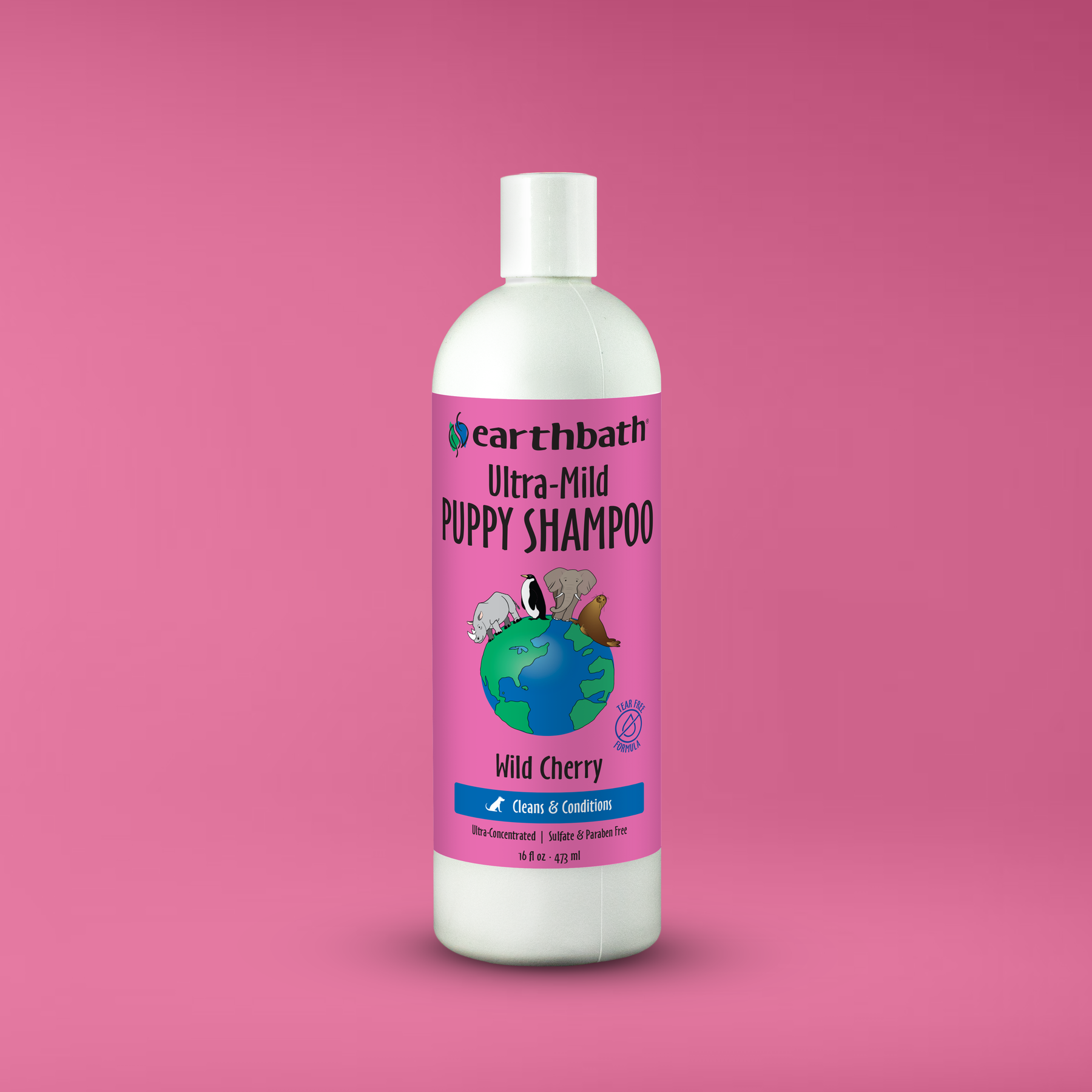 Earthbath Ultra-Mild Puppy Shampoo bottle on a pink background