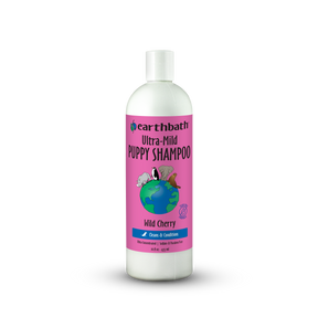 Bottle of Earthbath Ultra-Mild Puppy Shampoo with a pink label on a white background