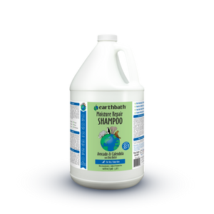 A one-gallon white plastic jug of earthbath Moisture Repair Shampoo, featuring a green and blue label with a globe graphic, set against a white background.