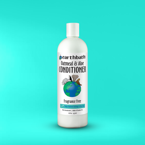 Earthbath Oatmeal & Aloe Conditioner bottle on a teal background