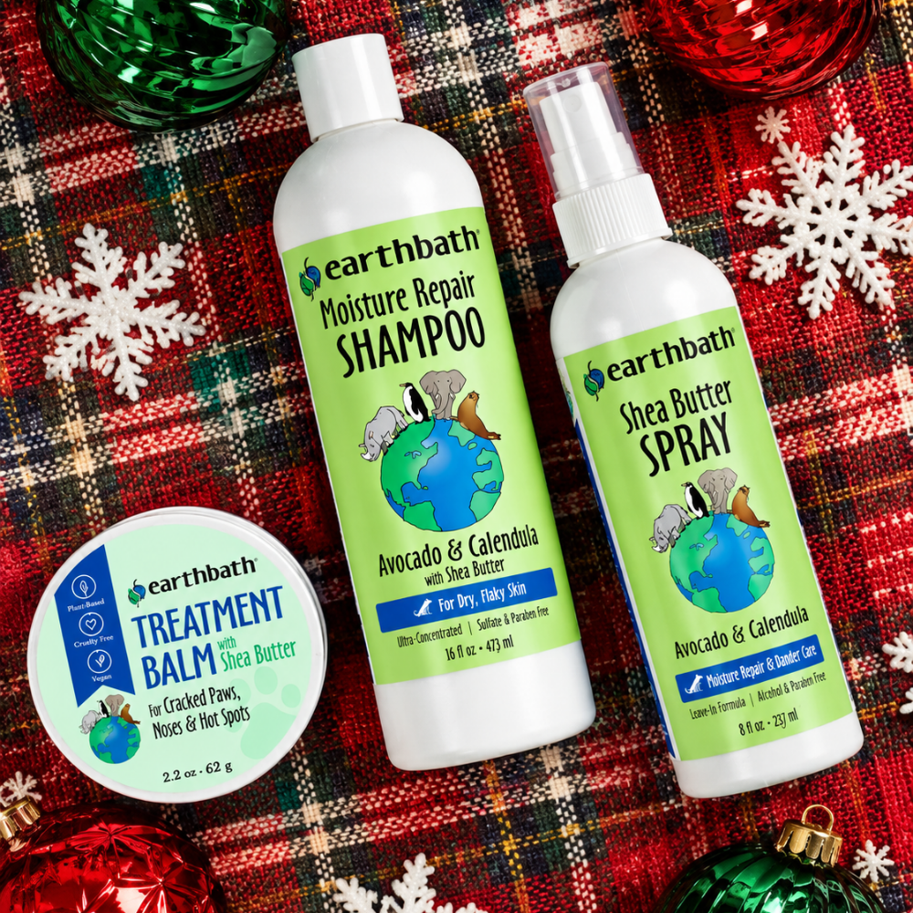 earthbath Moisture Repair shampoo bottle, spray bottle and balm jar on red Christmas plaid fabric